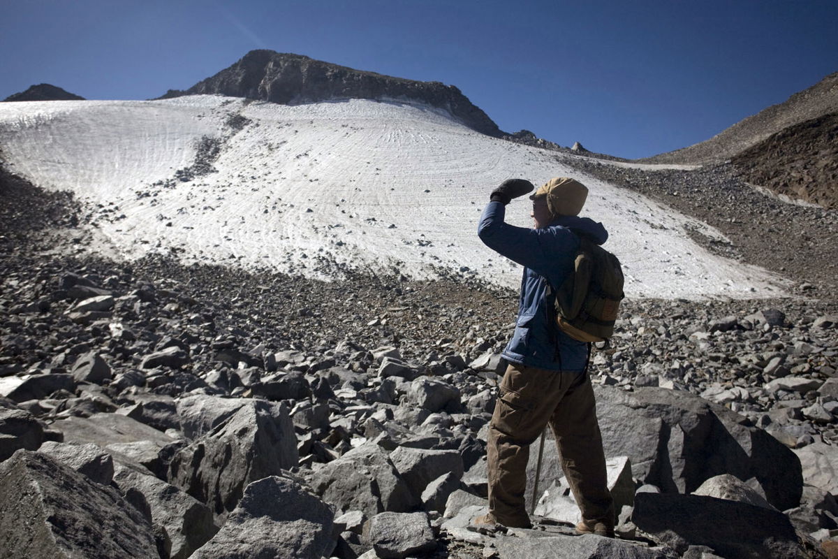 <i>Randy Pench/Sacramento Bee/Tribune News Service/Getty Images</i><br/>A hiker looks out at the Lyell glacier in Yosemite National Park in 2008.