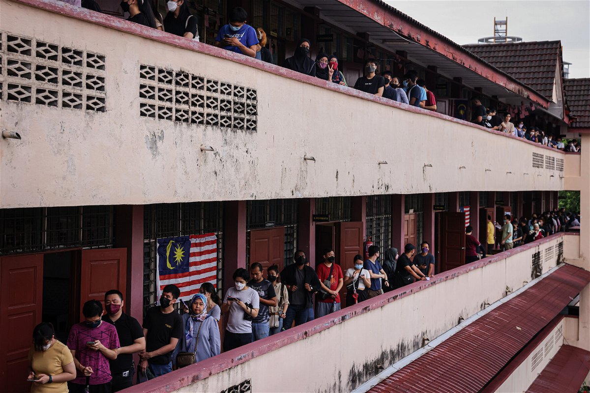 <i>Annice Lyn/Getty Images</i><br/>Voters wait in line at a polling station during the 15th general election in Kuala Lumpur