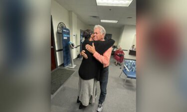 Highsmith hugs her father while being reunited after decades of separation.