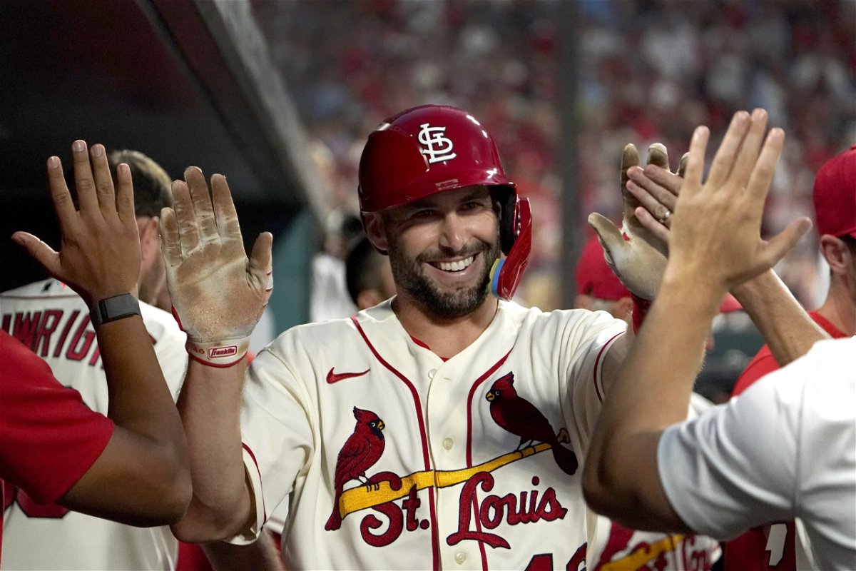 FILE - St. Louis Cardinals' Paul Goldschmidt is congratulated by teammates after scoring during the seventh inning of a baseball game against the Milwaukee Brewers Saturday, Aug. 13, 2022, in St. Louis. New AL home run king Aaron Judge and St. Louis slugger Paul Goldschmidt won Hank Aaron Awards on Wednesday, Nov. 9, 2022, that reward the most outstanding offensive performers in each league. 
