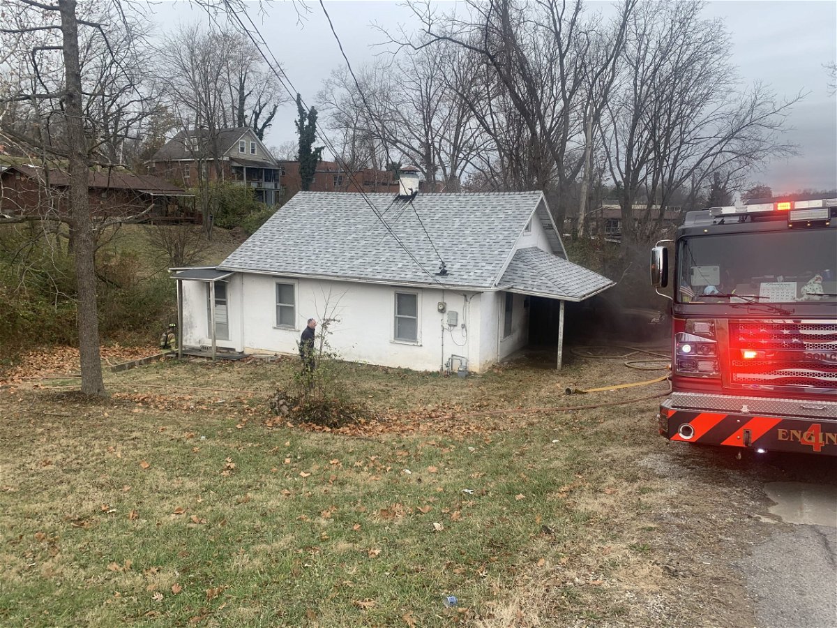 Firefighters work at a home in Jefferson City on Friday, Dec. 2, 2022.