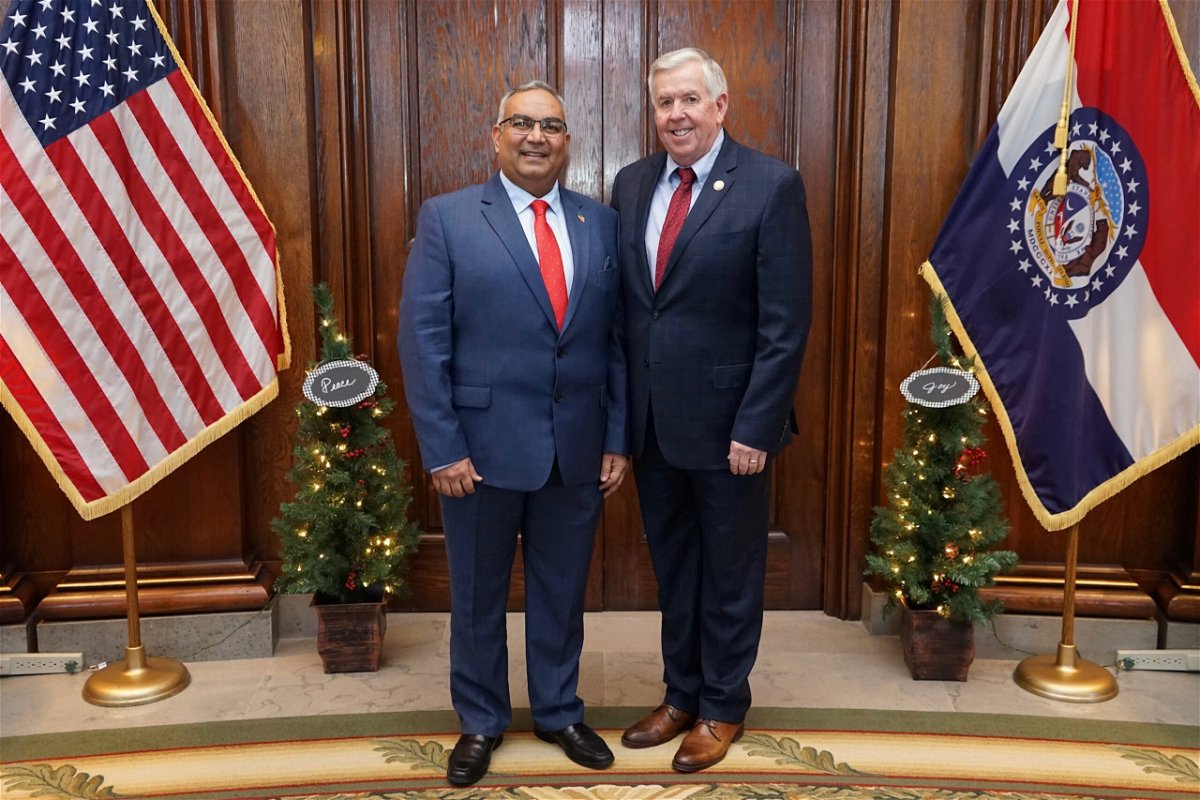 Gov. Mike Parson, right, stands with newly appointed State Treasurer Vivek Malek.