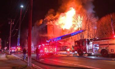 Parts of the roof collapsed as firefighters in Rhode Island battled a fire that engulfed a furniture store.