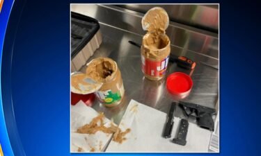 A Rhode Island man was arrested at John F. Kennedy International Airport for trying to smuggle a disassembled gun inside two containers of peanut butter.