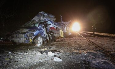 A driver is hospitalized after a car is struck by a Metra train in unincorporated Woodstock early Saturday morning.