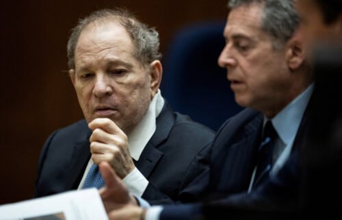 Former film producer Harvey Weinstein (left) interacts with his attorney