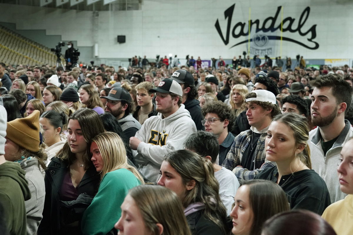 <i>Ted S. Warren/AP</i><br/>People attend a November 30 vigil for the four University of Idaho students stand in the Kibbie Dome as family members talk about their loved ones in Moscow
