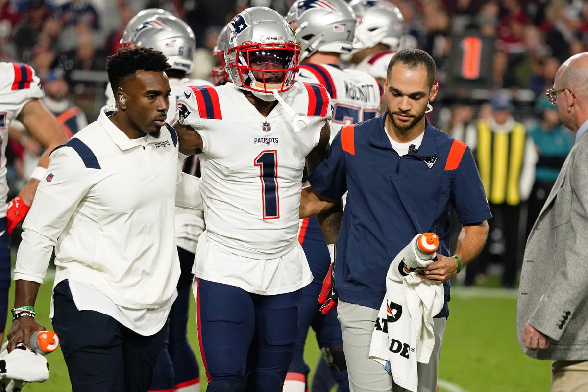 <i>DeVante Parker/AP</i><br/>New England Patriots wide receiver DeVante Parker is carried off the field after a play against the Arizona Cardinals in the first half.