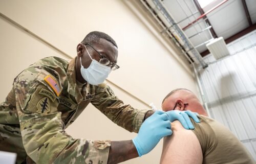 The House voted on Thursday to pass the defense bill that rescinds the US military's Covid-19 vaccine mandate. A soldier is here getting the Covid vaccine in September 2021 in Fort Knox
