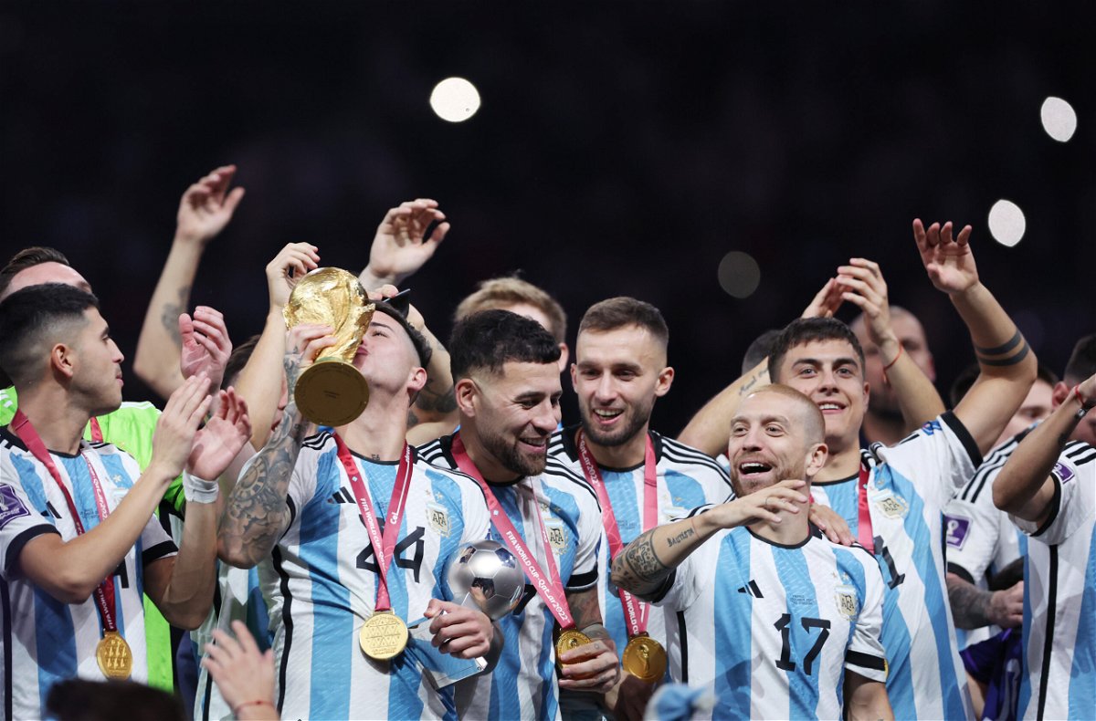 <i>Clive Brunskill/Getty Images Europe/Getty Images</i><br/>Argentina's players were overcome by emotion after lifting the World Cup trophy.