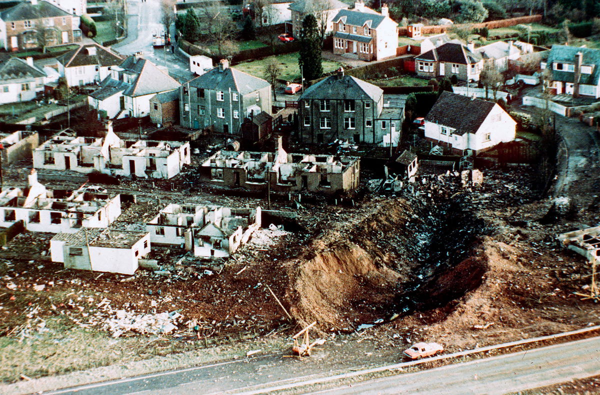<i>Martin Cleaver/AP</i><br/>This December 1988 file photo shows wrecked houses and a deep gash in the ground in the village of Lockerbie