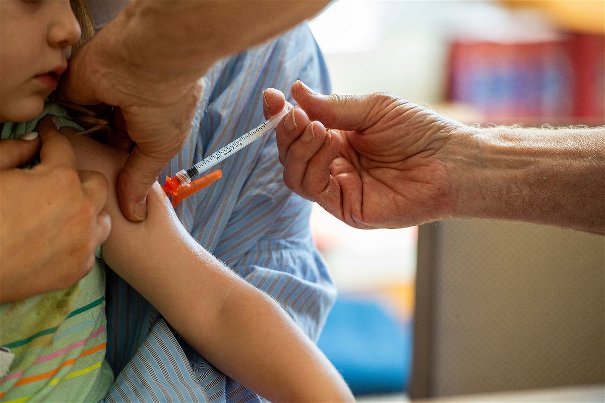 <i>Joseph Prezioso/AFP/Getty Images</i><br/>A young child receives a Moderna Covid-19 vaccine in Needham