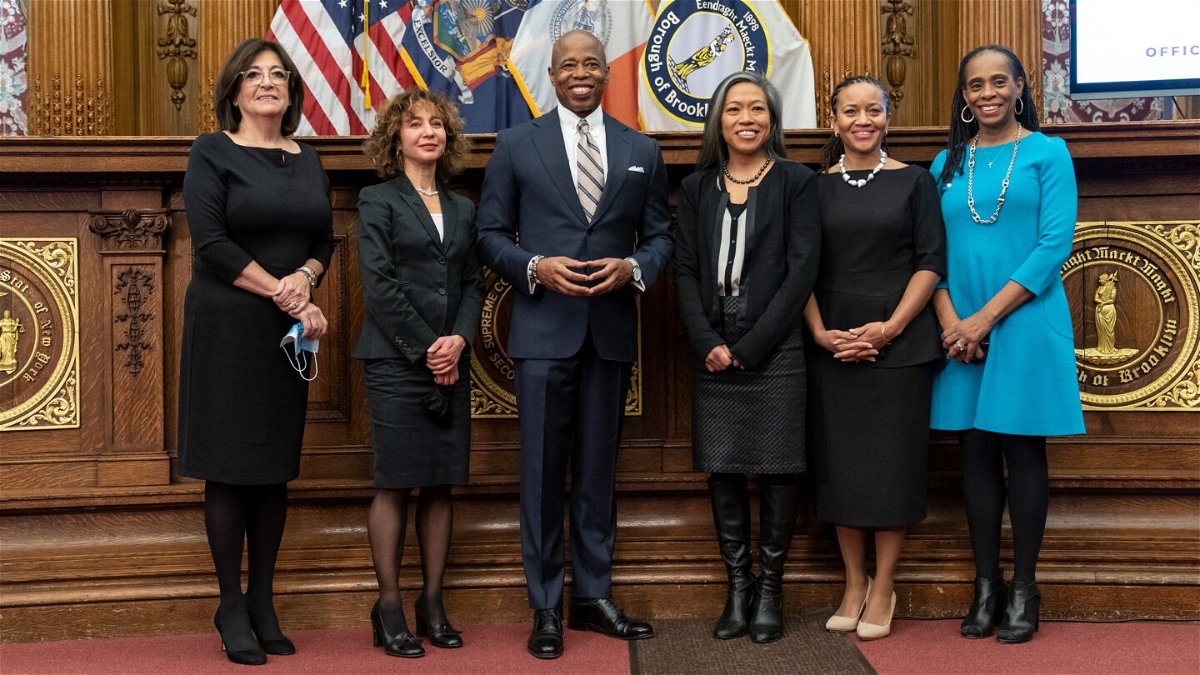 <i>Lev Radin/Pacific Press/LightRocket via Getty Images</i><br/>Mayor Eric Adams poses with five women who were appointed as his deputies last year. From L-R Lorraine Grillo