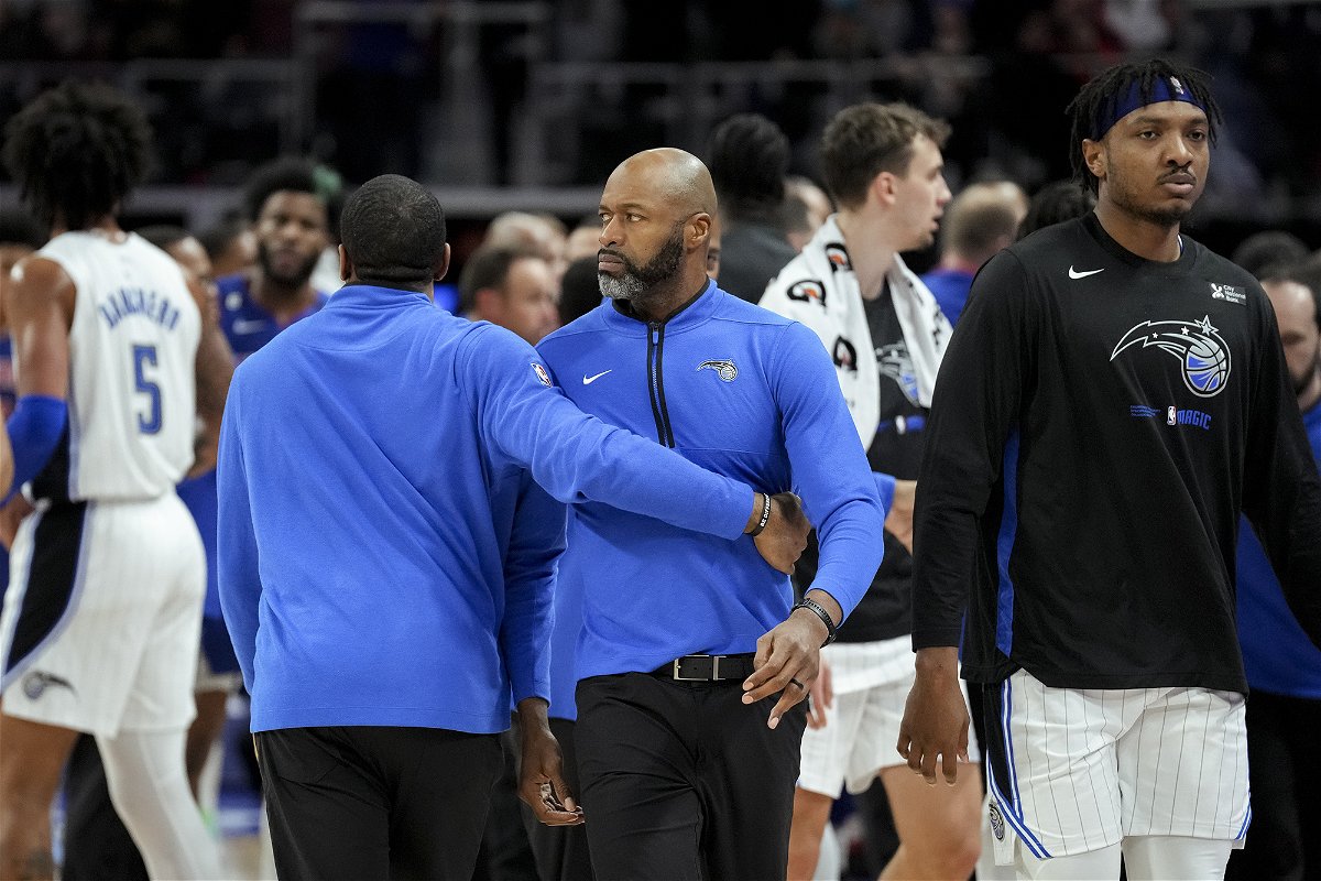 <i>Nic Antaya/Getty Images</i><br/>Orlando Magic head coach Jamahl Mosley is held back against the Detroit Pistons.