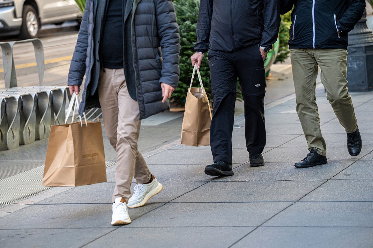 <i>David Paul Morris/Bloomberg/Getty Images</i><br/>Slower hiring. Weaker spending. And softer growth. That's what America's CEOs are bracing for as the economy heads into 2023 facing a series of obstacles. Shoppers are pictured here in San Francisco on November 29.