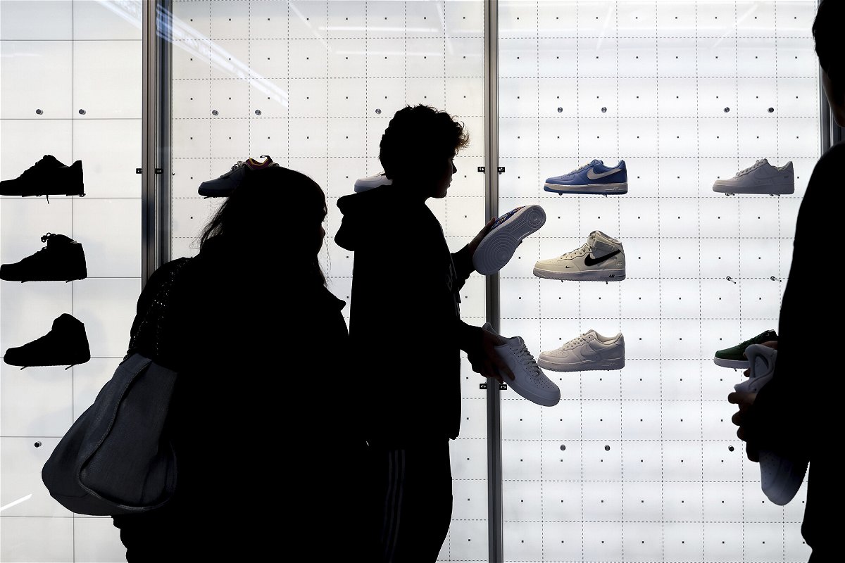 <i>Julia Nikhinson/AP</i><br/>People shop for shoes in a Nike store on Black Friday on November 25 in New York.