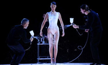 Bella Hadid's Coperni spray-on dress moment at Paris Fashion Week was named top viral moment of 2022 by fashion search engine Lyst.