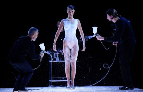 Bella Hadid's Coperni spray-on dress moment at Paris Fashion Week was named top viral moment of 2022 by fashion search engine Lyst.