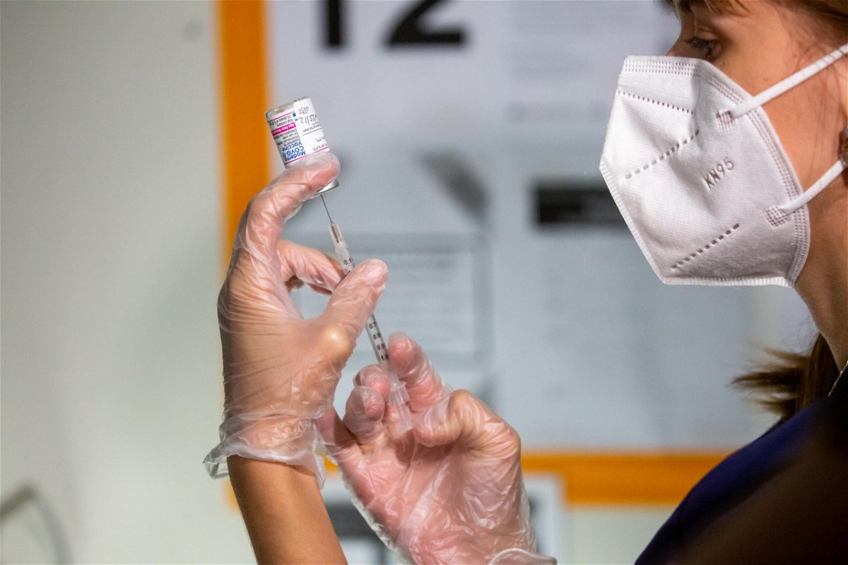 <i>Michael Nagle/Bloomberg/Getty Images</i><br/>A health care worker prepares a dose of the Moderna Covid-19 vaccine at the Brooklyn Children's Museum vaccination site in Brooklyn