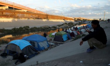 The Biden administration has decided to appeal a federal court decision that blocked the use of a controversial Trump-era policy allowing for the swift removal of migrants at the US-Mexico border. Migrants are seen in Ciudad Juarez