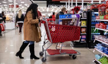 Shoppers wait in line to checkout at a Target store on Black Friday in Chicago