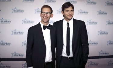 Twin brothers Michael and Ashton Kutcher pictured in 2013