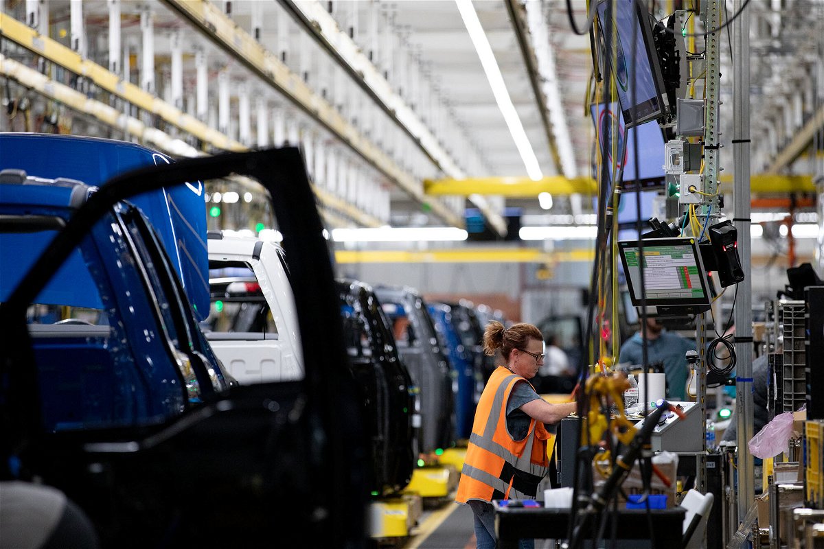 <i>Emily Elconin/Bloomberg/Getty Images</i><br/>A worker on the Ford F-150 Lightning production line at the Ford Motor Co. Rouge Electric Vehicle Center in Dearborn