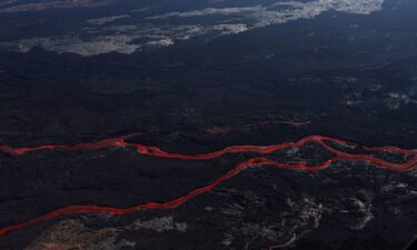 Lava flows from a fissure of Mauna Loa Volcano as it erupts in Hilo