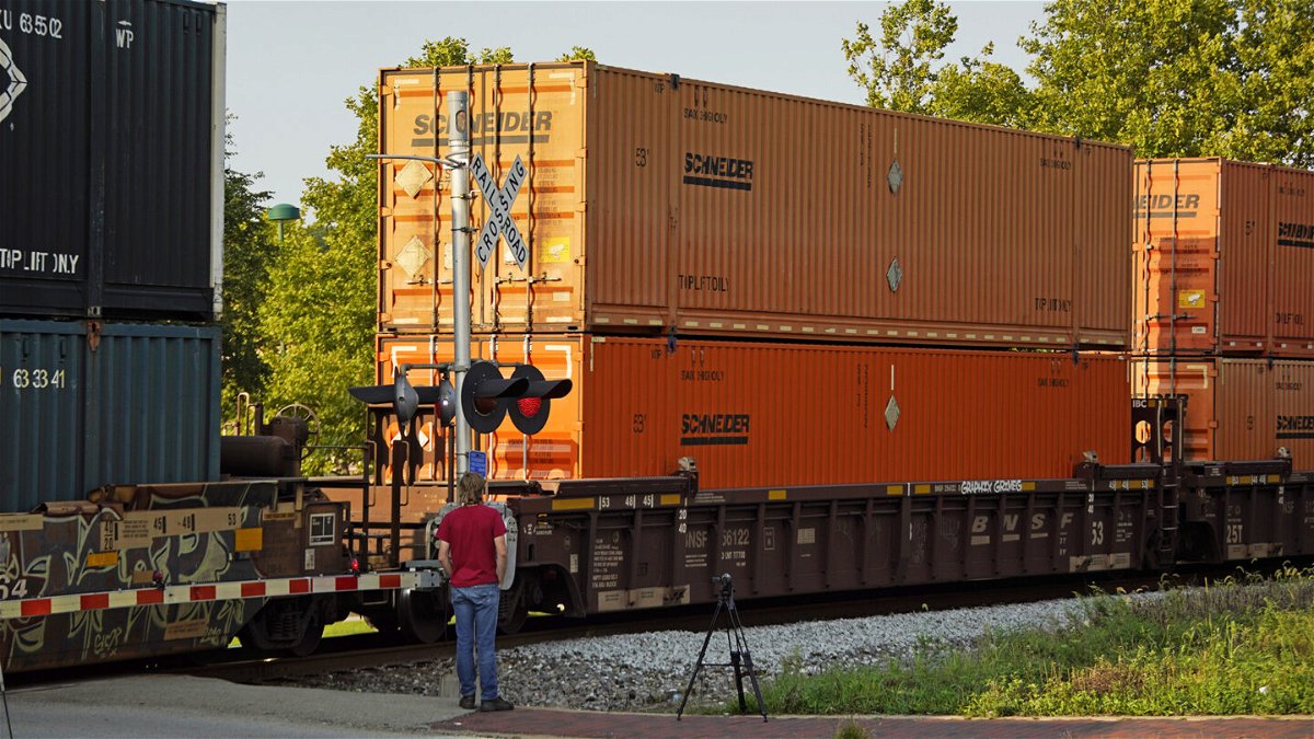 <i>Gene J. Puskar/AP/FILE</i><br/>A CSX freight train runs through a crossing in Homestead