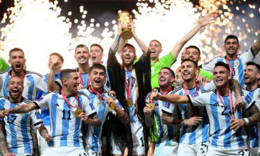 Botterill also snapped this image of the trophy lift where Messi is wearing a a black and gold bisht -- a traditional item of clothing worn in the region for special events and celebrations.