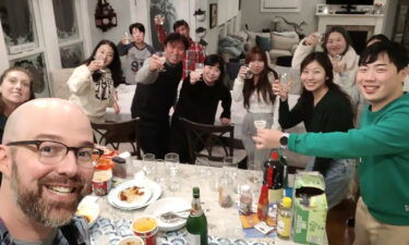 The Campagnas share a meal with a South Korean tour group who were stranded because of the storm.