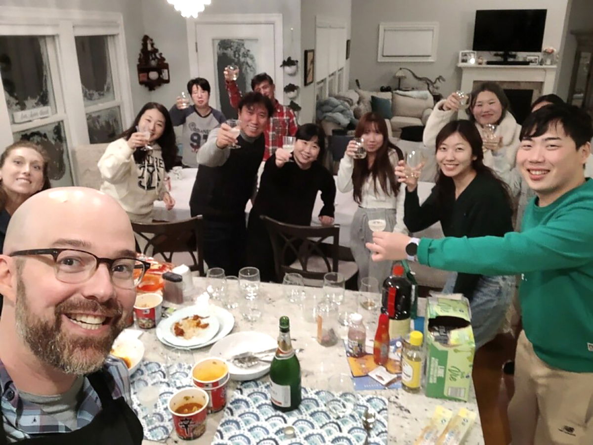<i>Courtesy Alexander Campagna</i><br/>The Campagnas share a meal with a South Korean tour group who were stranded because of the storm.