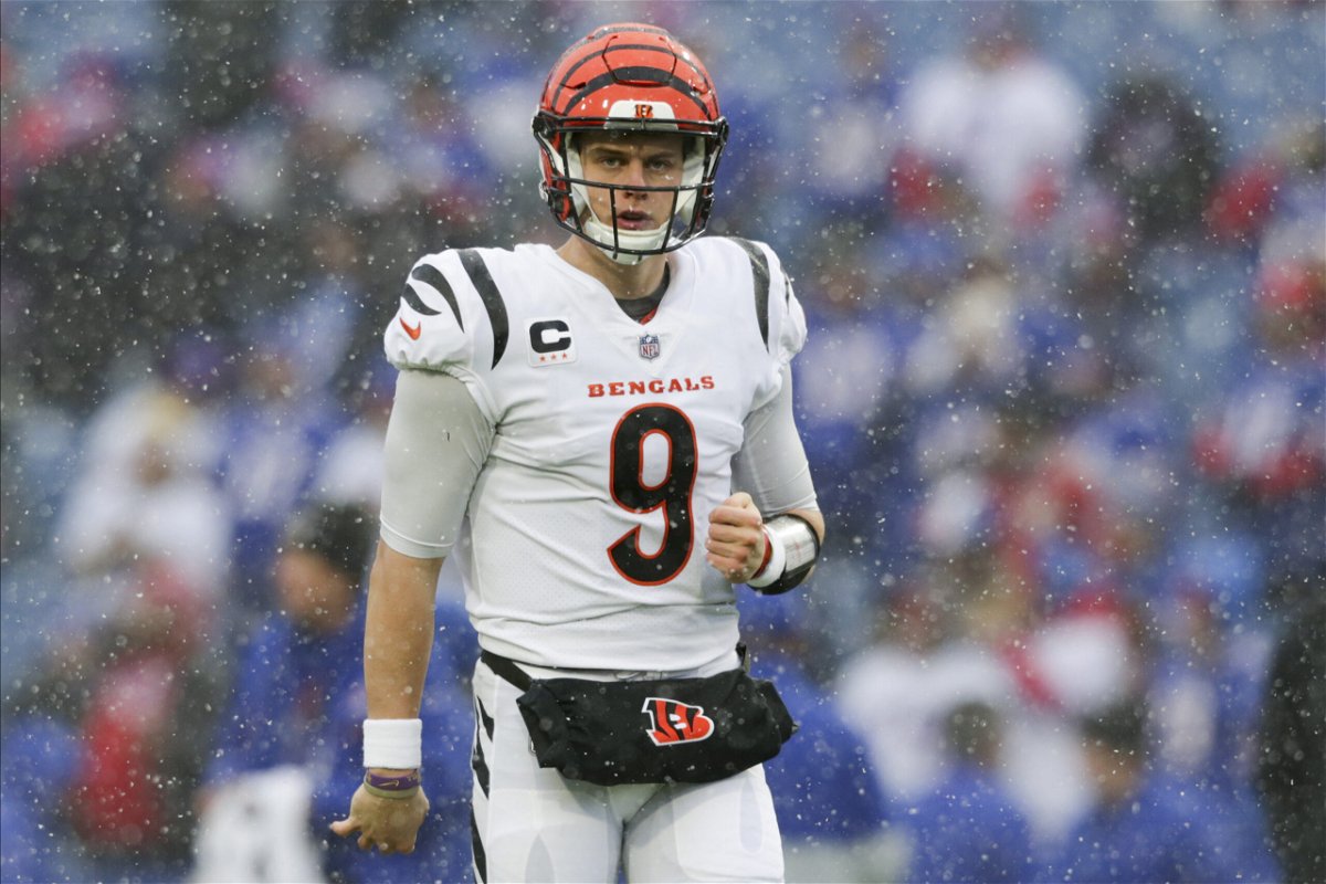 Cincinnati Bengals quarterback Joe Burrow (9) warms up before playing against the Buffalo Bills in an NFL division round football game, Sunday, Jan. 22, 2023, in Orchard Park, N.Y. 