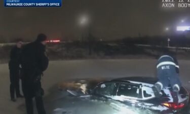 New body camera footage from a snowstorm in December shows first responders acting quickly to save a woman from a car partially submerged in a pond.