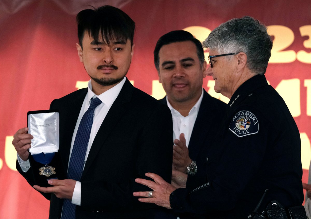 <i>Richard Vogel/AP</i><br/>Brandon Tsay (left) was given a standing ovation during a ceremony to honor him on January 29.