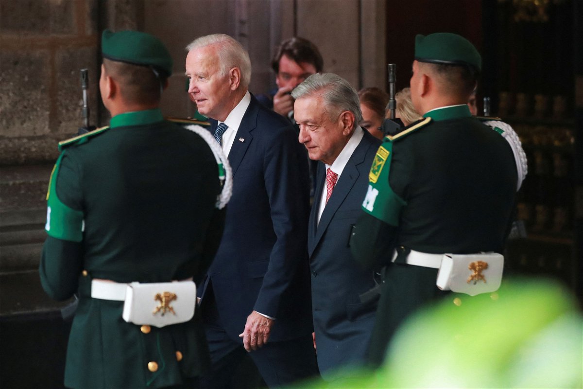 <i>Henry Romero/Reuters</i><br/>President Joe Biden meets his Mexican counterpart Andres Manuel Lopez Obrador at an official welcoming ceremony before taking part in the North American Leaders' Summit in Mexico City