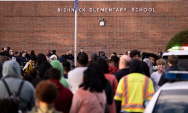Students and police gather outside of Richneck Elementary School in Newport News