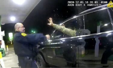 Caron Nazario is seen in this still image from body camera footage holding his hands up during the traffic stop in Windsor