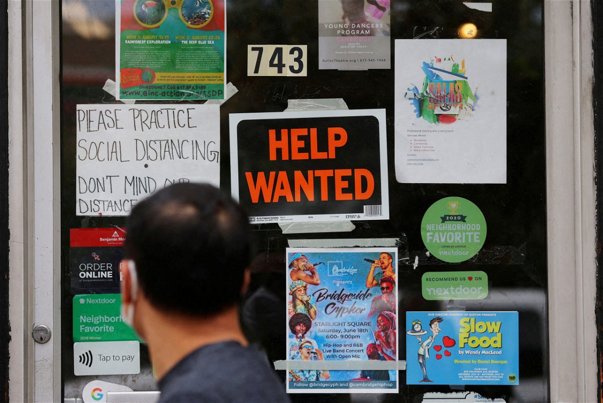 <i>Brian Snyder/Reuters</i><br/>Economists are betting that the labor market cooled in December. A pedestrian passes a 