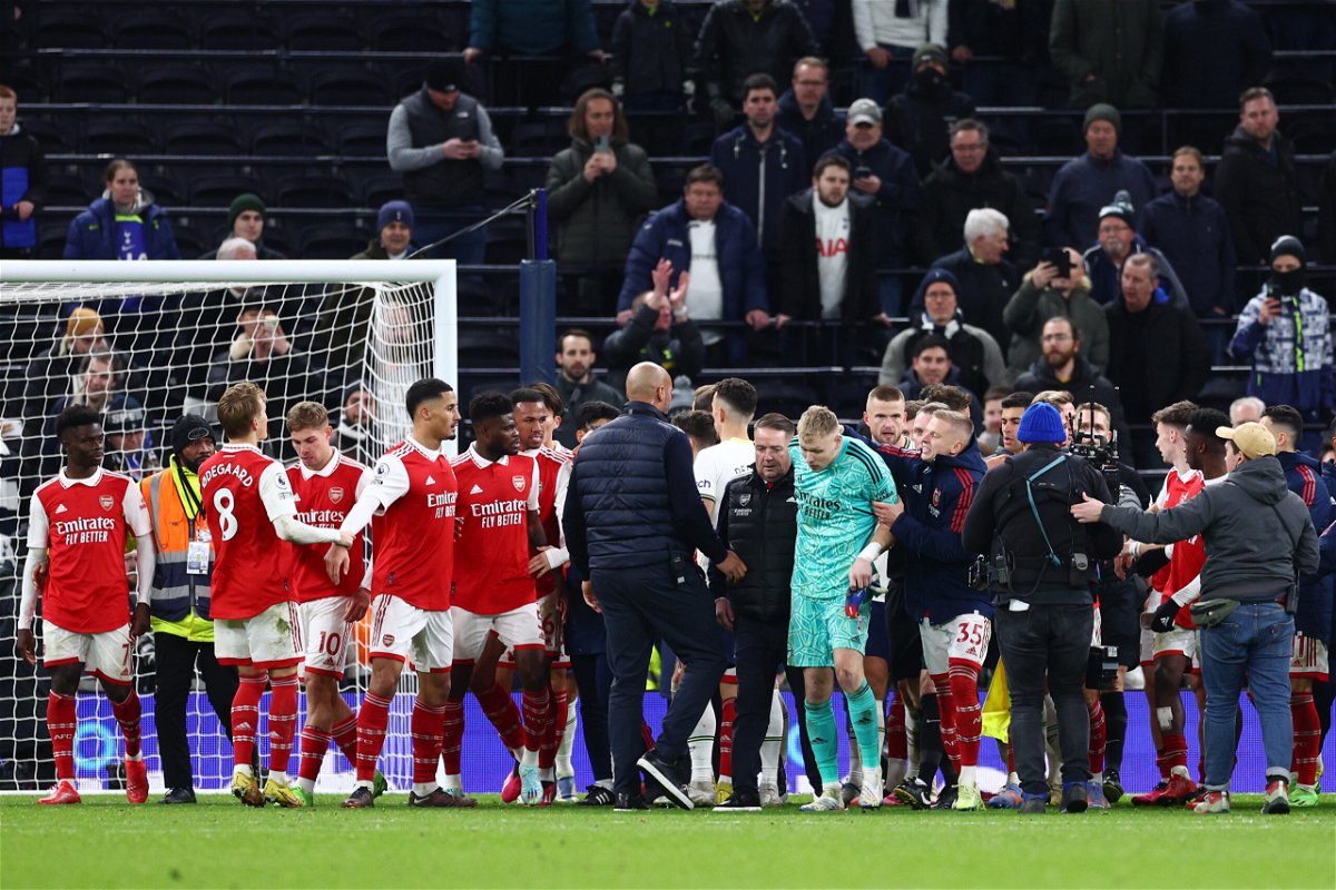 <i>Clive Rose/Getty Images</i><br/>Aaron Ramsdale (in teal) is escorted away shortly after the end of Sunday's match.