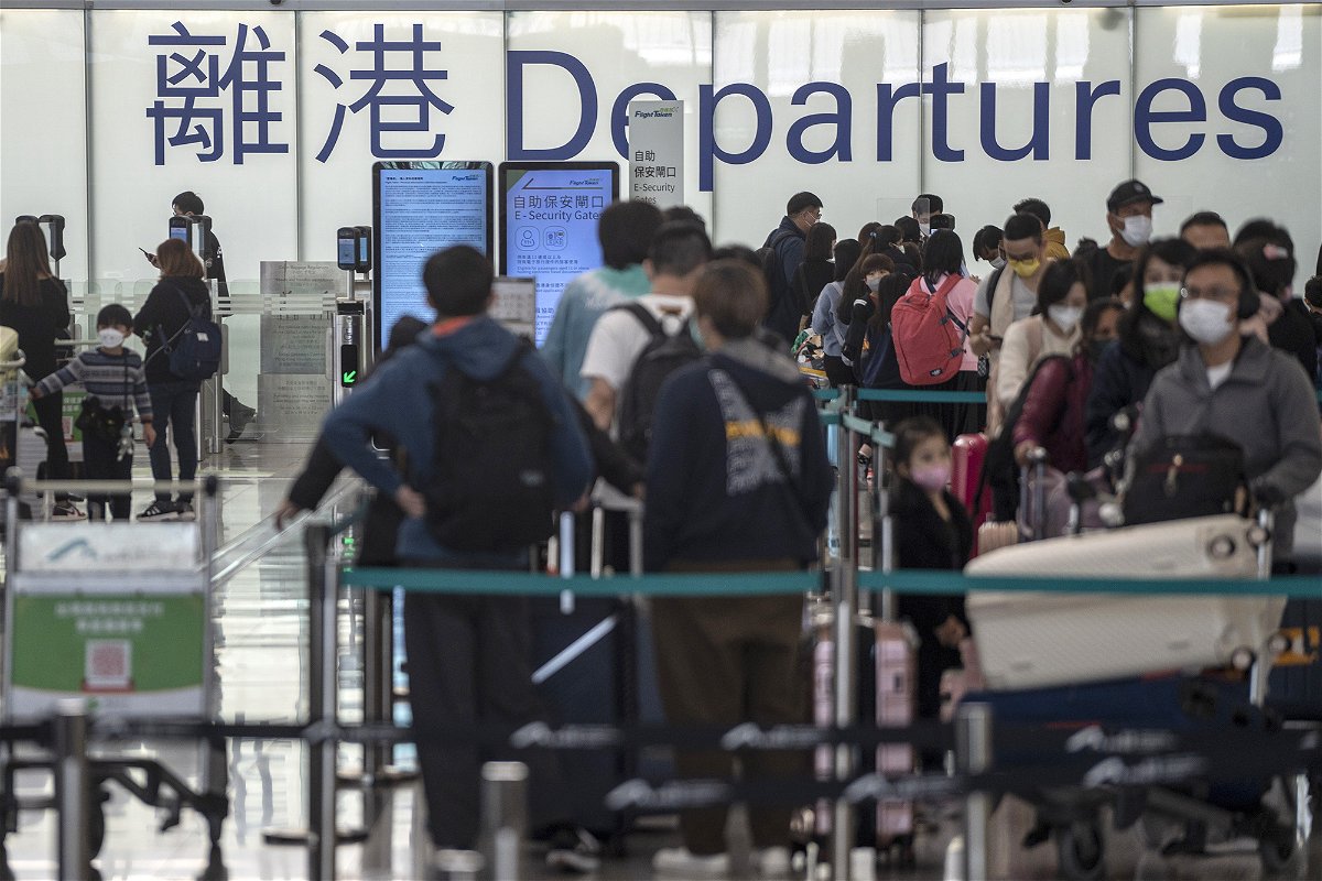 <i>Vernon Yuen/NurPhoto/Getty Images</i><br/>Australia's top health adviser urged the government against restrictions on travelers from China. Pictured are travelers at the Hong Kong International Airport on December 20
