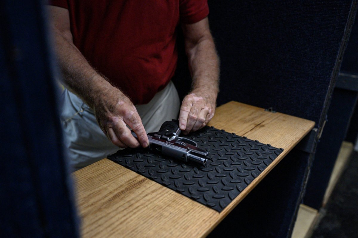 <i>Ed Jones/AFP/Getty Images</i><br/>Shooting range owner John Deloca prepares his pistol at his range in Queens