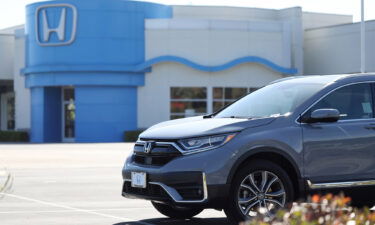 Auto sales are falling but profits are surging. Pictured is a Honda dealership on June 09