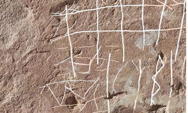 The stone features "unexpected" inscriptions.