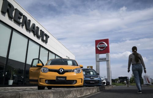 Renault will slash stake in Nissan as they overhaul their alliance. Pictured is a Nissan and Renault car dealership on May 27
