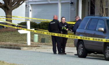 Police work at the scene of a murder-suicide in High Point