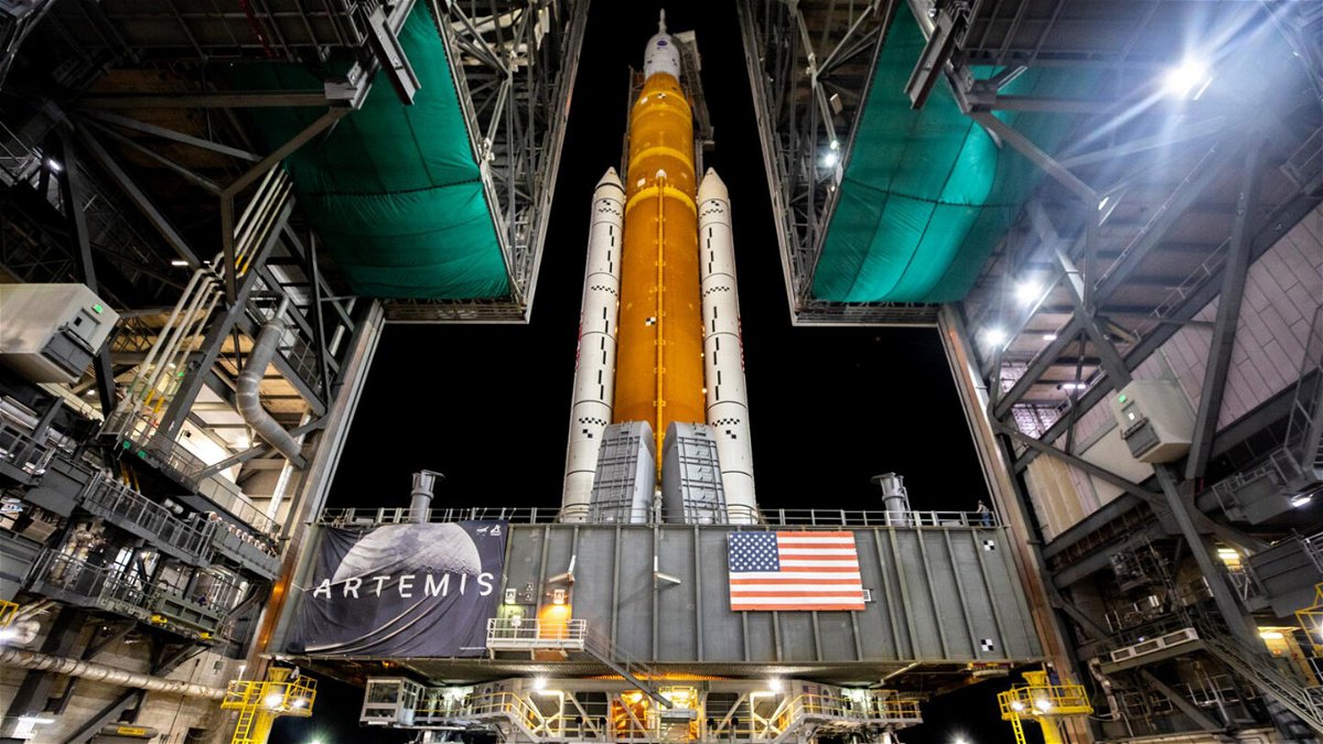 <i>Ben Smegelsky/NASA</i><br/>The mobile launcher with NASA's SLS rocket and Orion spacecraft rolls out of the Vehicle Assembly Building's High Bay 3 to Launch Complex 39B on August 16