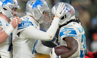 Jamaal Williams #30 of the Detroit Lions celebrates with teammates after scoring a touchdown during the fourth quarter against the Green Bay Packers on January 08
