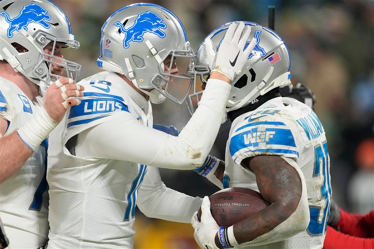 <i>Patrick McDermott/Getty Images</i><br/>Jamaal Williams #30 of the Detroit Lions celebrates with teammates after scoring a touchdown during the fourth quarter against the Green Bay Packers on January 08