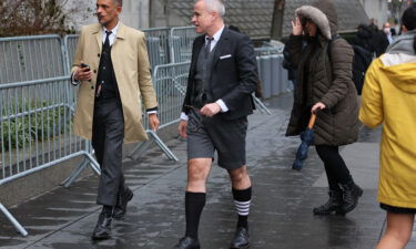Fashion Designer Thom Browne arrives to court on January 3 wearing one of his brand's signature four-striped socks.